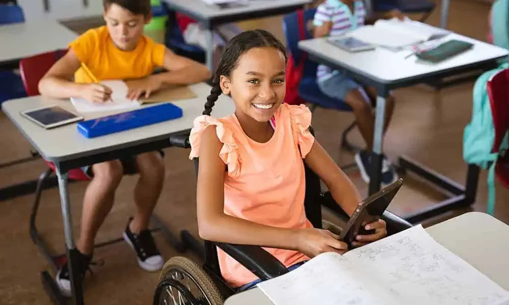 Young-girl-in-wheelchair-using-iPad.