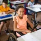 Young-girl-in-wheelchair-using-iPad.