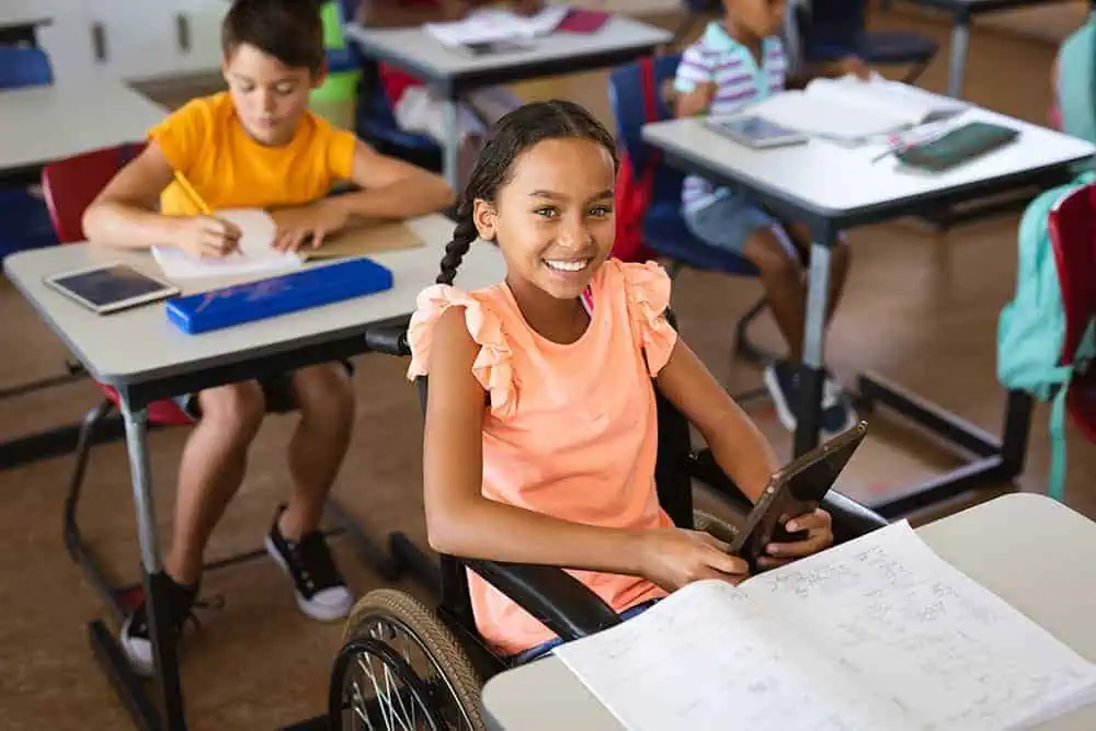 Young-girl-in-wheelchair-using-iPad.