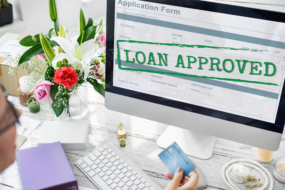 Happy Indian couple celebrating credit score approval for loan